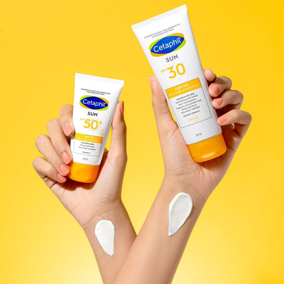 The women is applying sunscreen on her face and providing extra care for her sensitive skin.